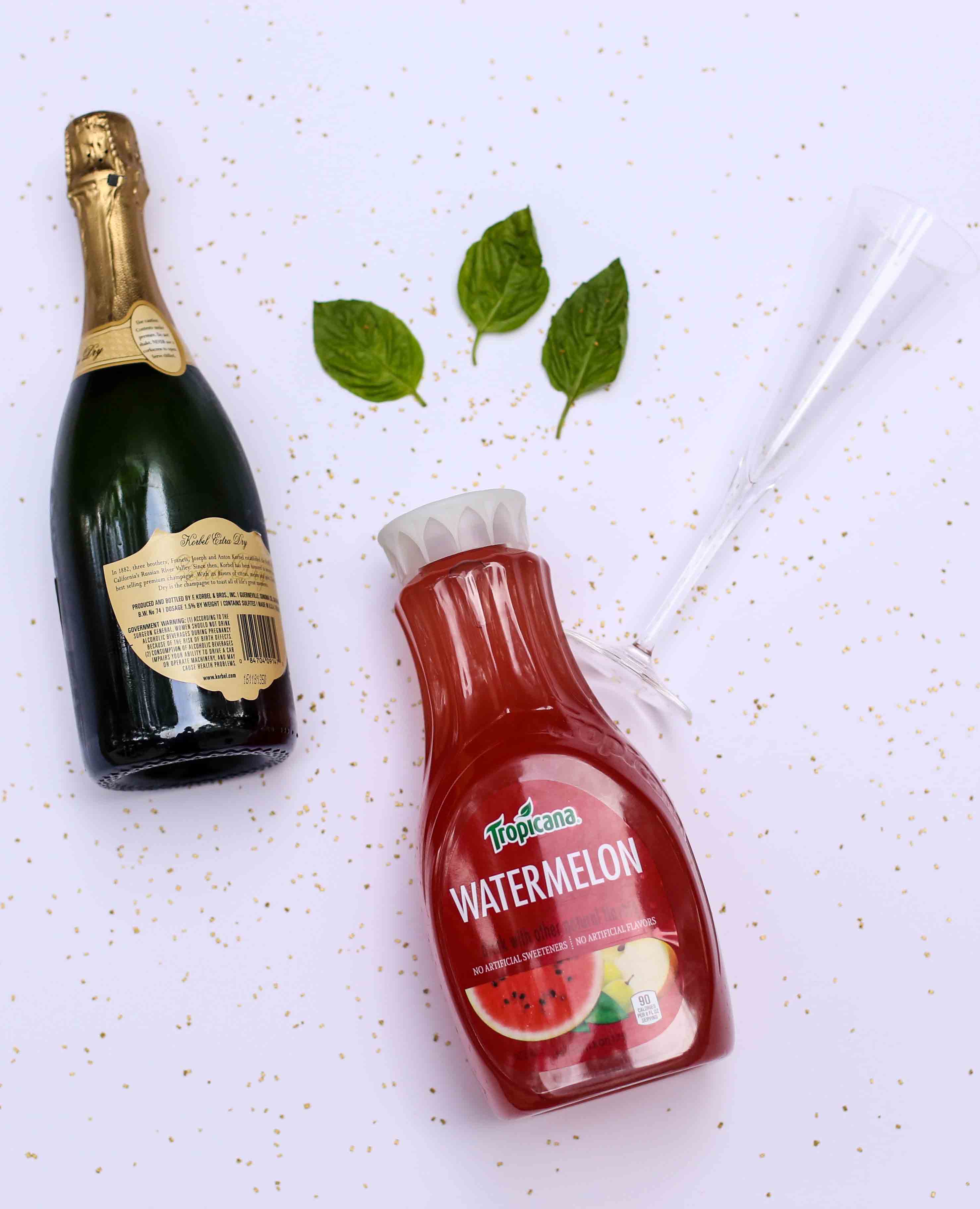 howtomakewatermelonbasilmartinis - Holiday Beverages: Watermelon Basil Sparklers by Atlanta lifestyle blogger Happily Hughes