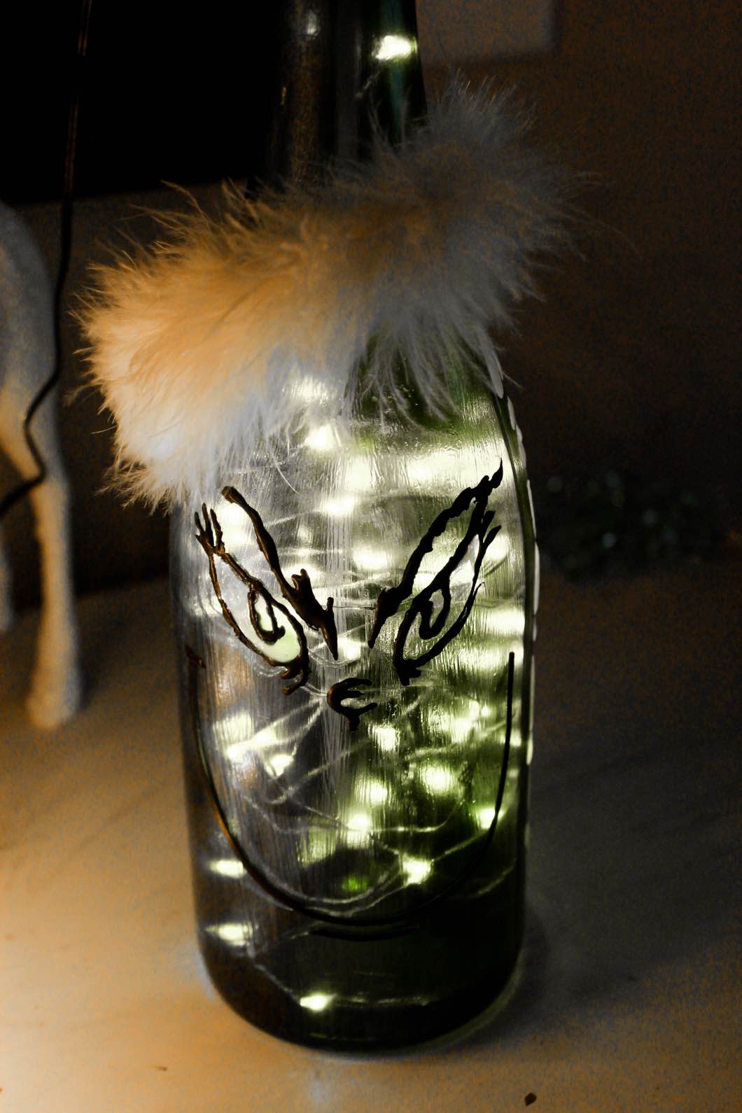 Grinch Wine Painted Bottle - Christmas Painted Wine Bottles by Atlanta style blogger Happily Hughes