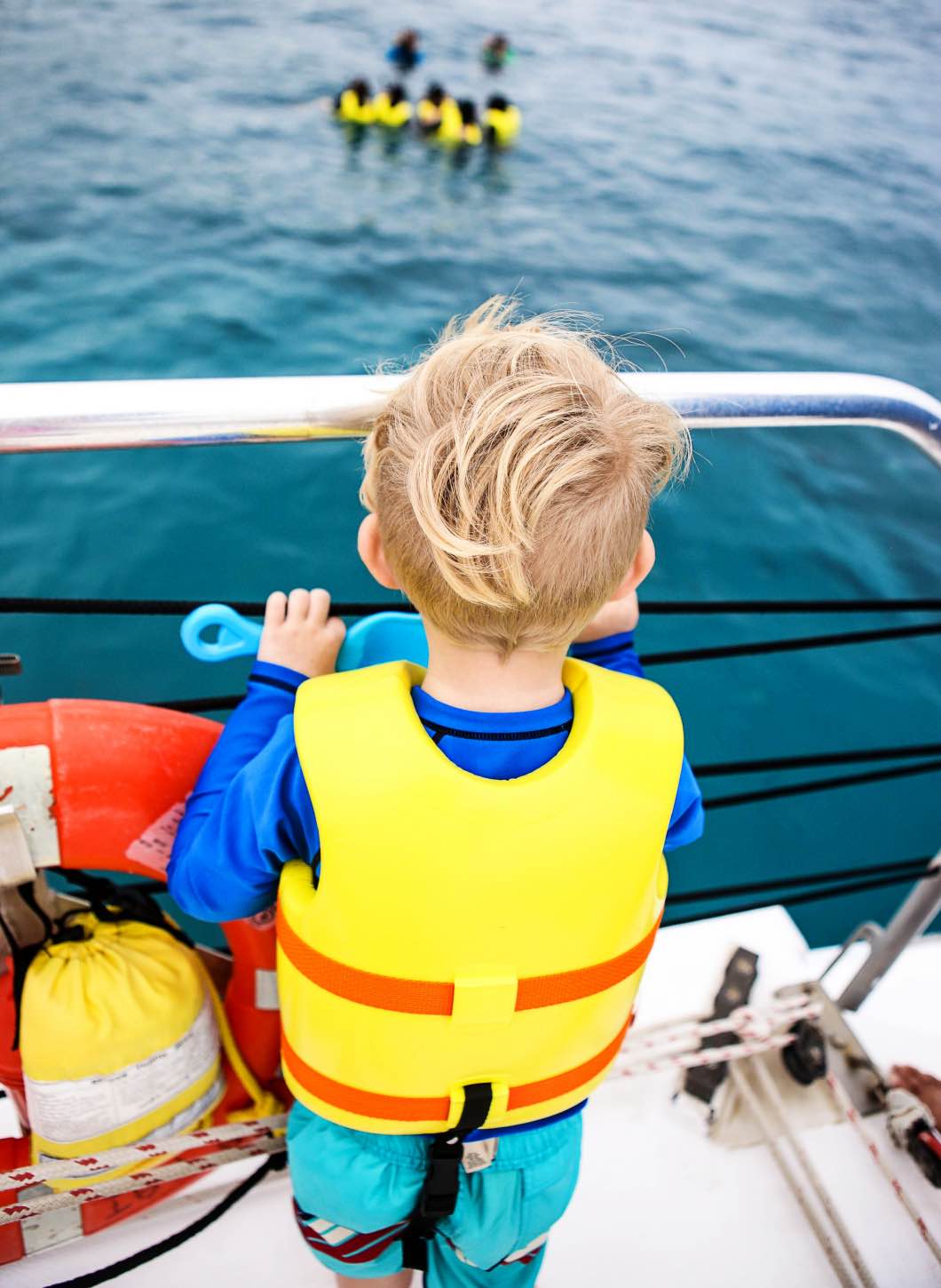 boy on a boat snorkeling